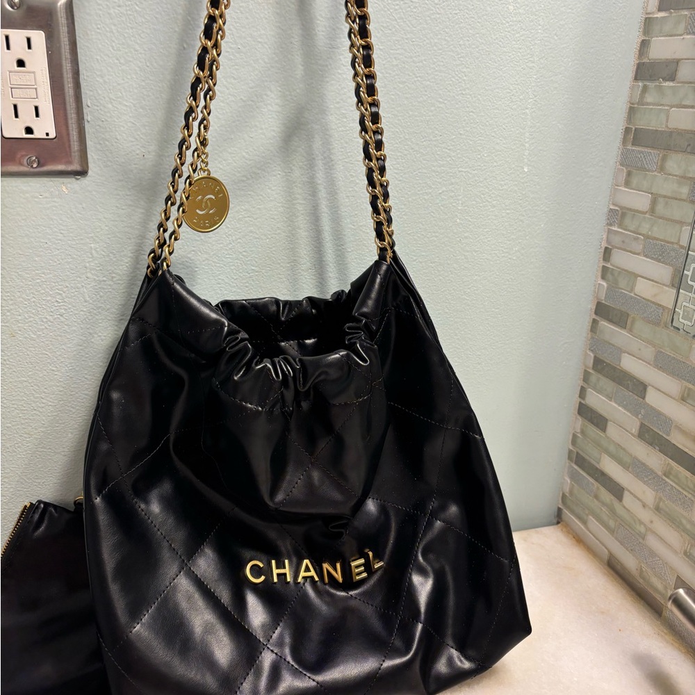 CHANEL Black Quilted Drawstring Shoulder Bag with Gold Hardware
